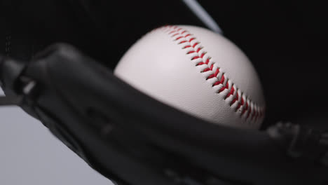 Close-Up-Baseball-Shot-With-Baseball-Ball-Being-Thrown-And-Caught-In-Catchers-Mitt